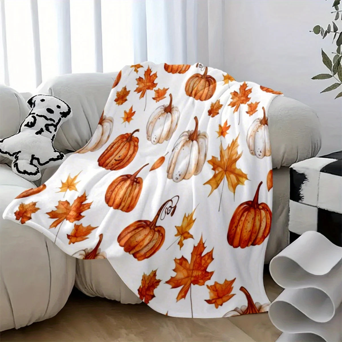 Herbstdecke mit Kürbis- und Blättermuster