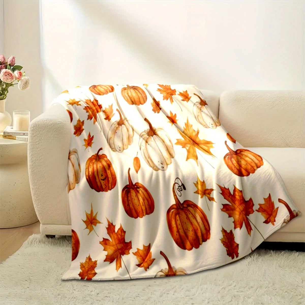 Herbstdecke mit Kürbis- und Blättermuster